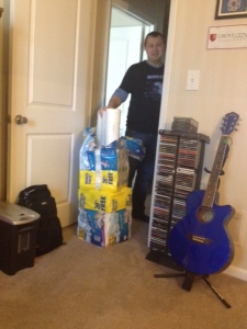 Andrew attempting to fit it all in our small bathroom closet... 